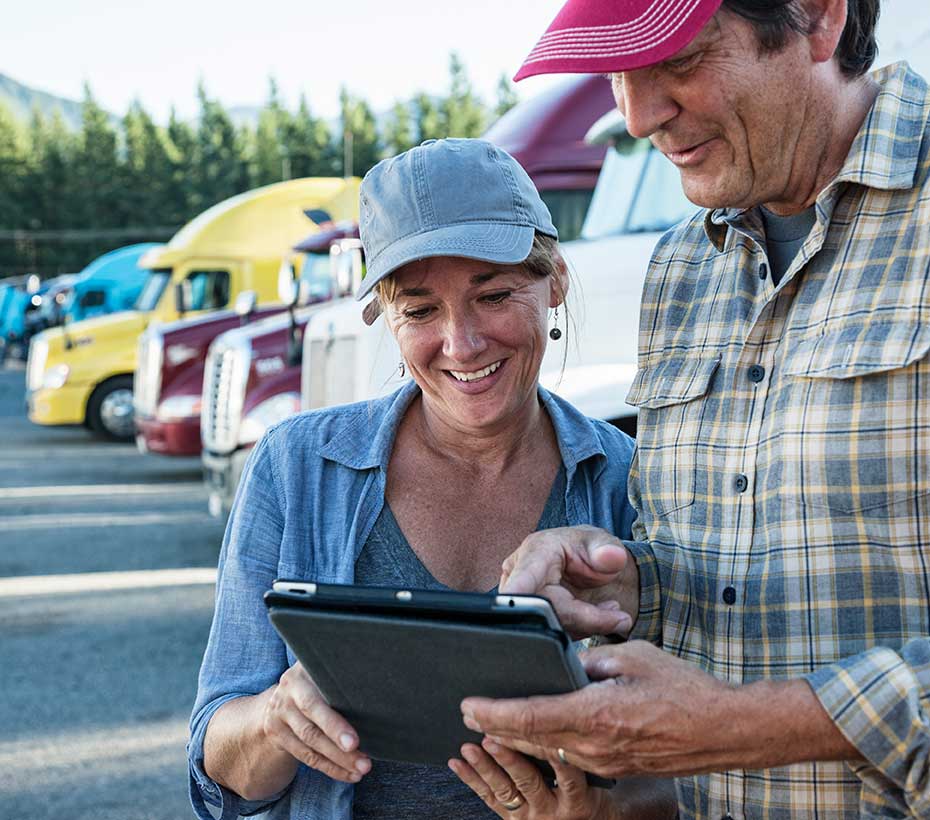 caucasian woman and man truck driving team-working